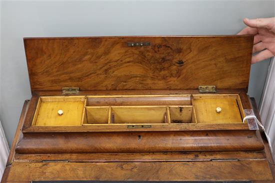 A late Victorian walnut davenport W.56cm